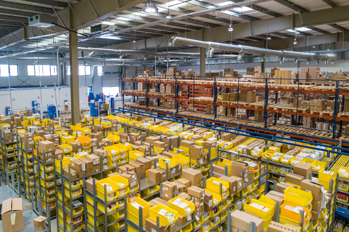 Large warehouse with organized shelving and parcels