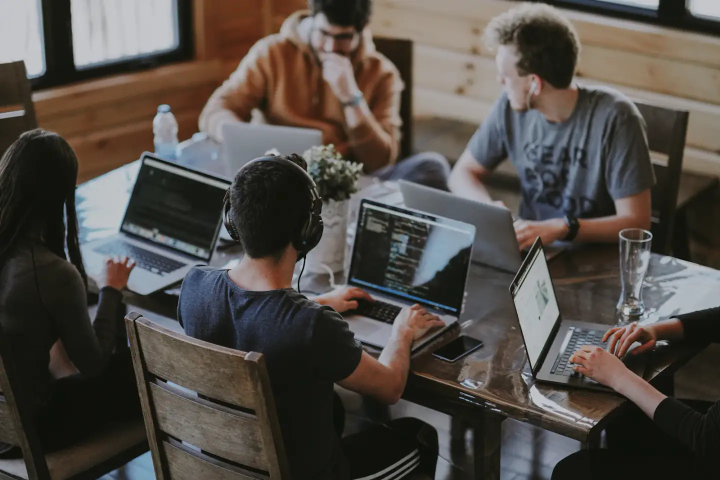 Designers and developers working together on laptops